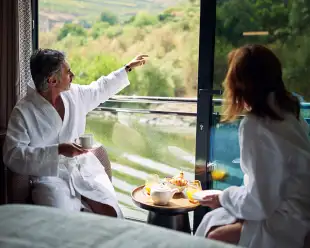 Couple looking out of upper deck window