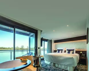 Interior of a cabin bedroom aboard the George Eliot cruise ship