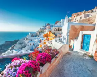 Beautiful view over Santorini white painted houses and the ocean in Greece
