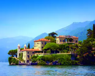 View of Villa del Balbianello building from Lake Como in Italy
