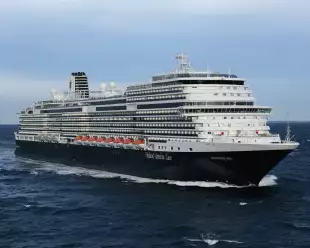 Side view of a cruise ship in transit along the ocean