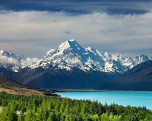 Bright blue water infront of the New Zealand National Park, Mt Cook