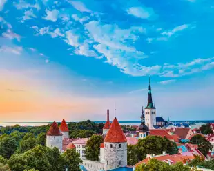 Toompea Castle before sunset, featuring surrounding treelines, Estonia