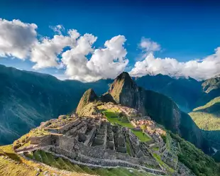 An aerial view of Historic Sanctuary of Machu Picchu and the surrounding peaks