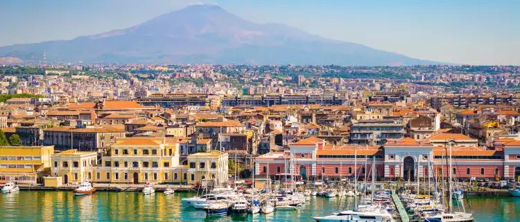 Beautiful view of Catania cruise port with smoking volcano Etna in the background