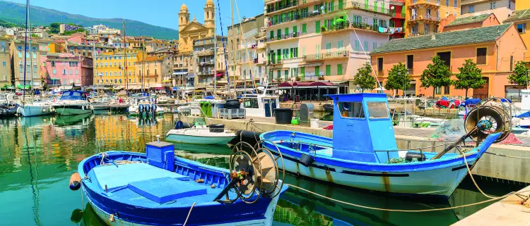 Traditional fishing boats in Bastia port in Corsica island, France