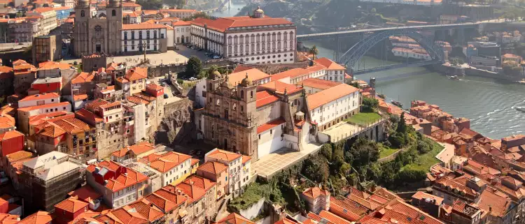 An aerial shot of the Porto Cathedrals next to the Douro River, Portugal