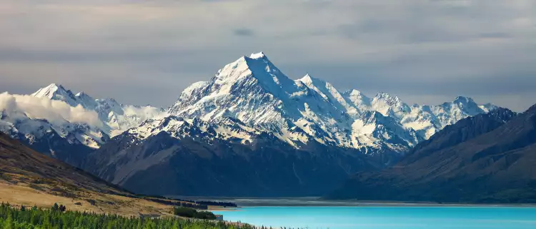Bright blue water infront of the New Zealand National Park, Mt Cook