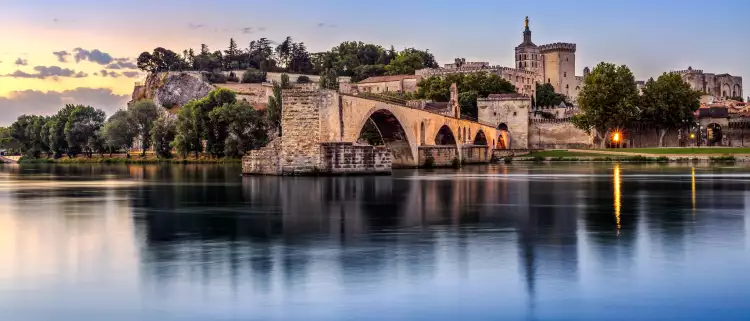 Avignon Bridge with Popes Palace and Rhone river in Pont Saint-Benezet, France
