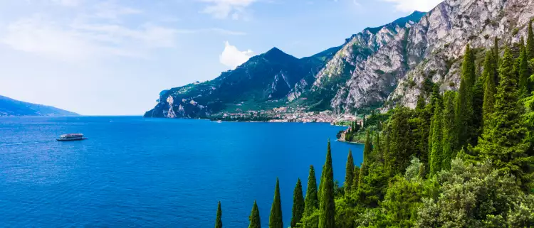 Lake Garda with mountains and vegetation in Italy