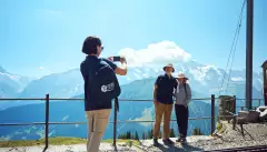 Riviera Tour Manager taking couples photo in Switzerland