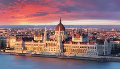 Aerial view of parliament building at dramatic sunrise in Budapest, Hungary