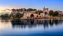 Avignon Bridge with Popes Palace and Rhone river in Pont Saint-Benezet, France