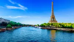 View of the Eiffel Tower and river Seine on a sunny day in Paris, France