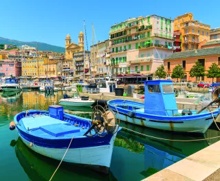Traditional fishing boats in Bastia port in Corsica island, France