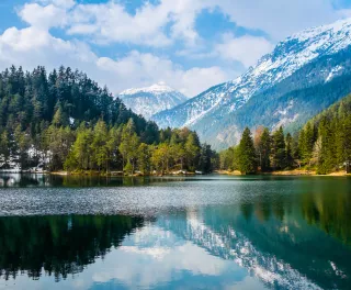 Fantastic views of the tranquil lake with amazing reflection. Mountains & glacier in the background. Peaceful & picturesque landscape. Location: Austria, Europe.