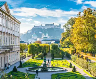 Beautiful view of famous Mirabell Gardens with the old historic Fortress Hohensalzburg in the background in Salzburg, Austria