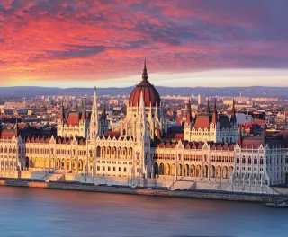 Aerial view of parliament building at dramatic sunrise in Budapest, Hungary