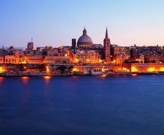 View of Valletta illuminated at night in Malta