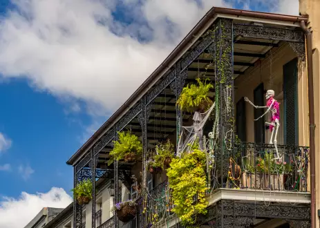 Halloween decorations on traditional New Orleans building in the French Quarter with wrought iron balconies