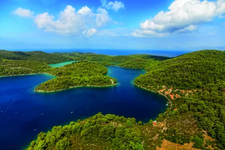 Aerial shot of the National Park on the island of Mijet, Croatia. Also known as a “green island” for its lush vegetation, its beauty consists of contrasting rocks, caves and cliffs against blue waters.
